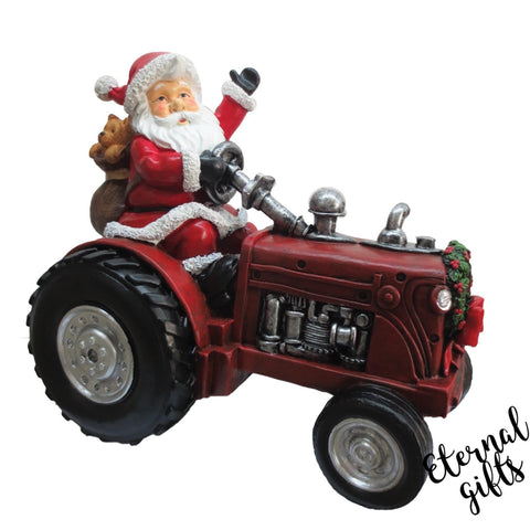 Santa on Vintage Red Polyresin Tractor.